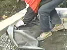 fold the geotextile over the drainage system