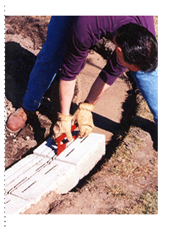 Installing the base course of a VERSA-LOK retaining wall